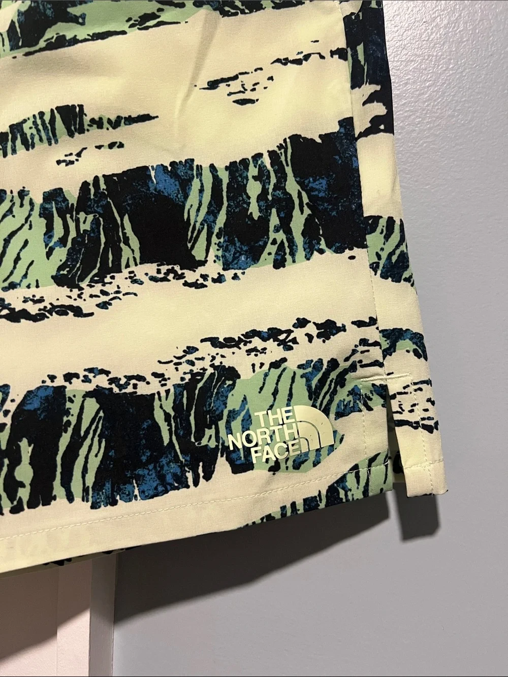 The North Face Pale Yellow Swim Trunks with Black and Teal Brush Print